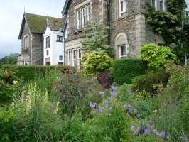 Yewfield is surrounded by colourful gardens and flower beds