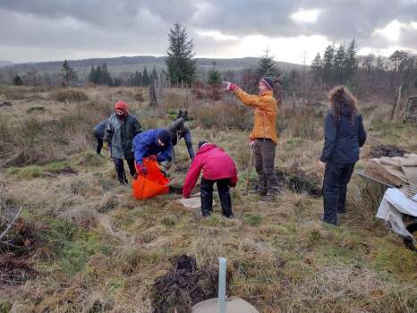 Getting some help from Brockwood Park School staff planting trees