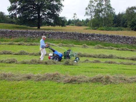 Rowing up the hay with the tedder attachment